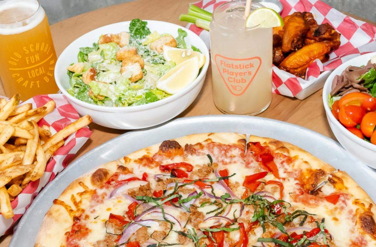 Flatstick Pub, a Seattle-area chain where games are central to the experience, serves a full menu of pizza and appetizers paired exclusively with Washington-made beer.