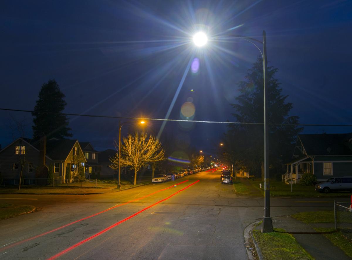 A single LED streetlight on South Yakima Avenue stands out for its white light among the yellow high pressure sodium lights that illuminate the rest of the street, January 16, 2019. Tacoma Public Utilities is swapping in the more efficient LED lights all over the city.