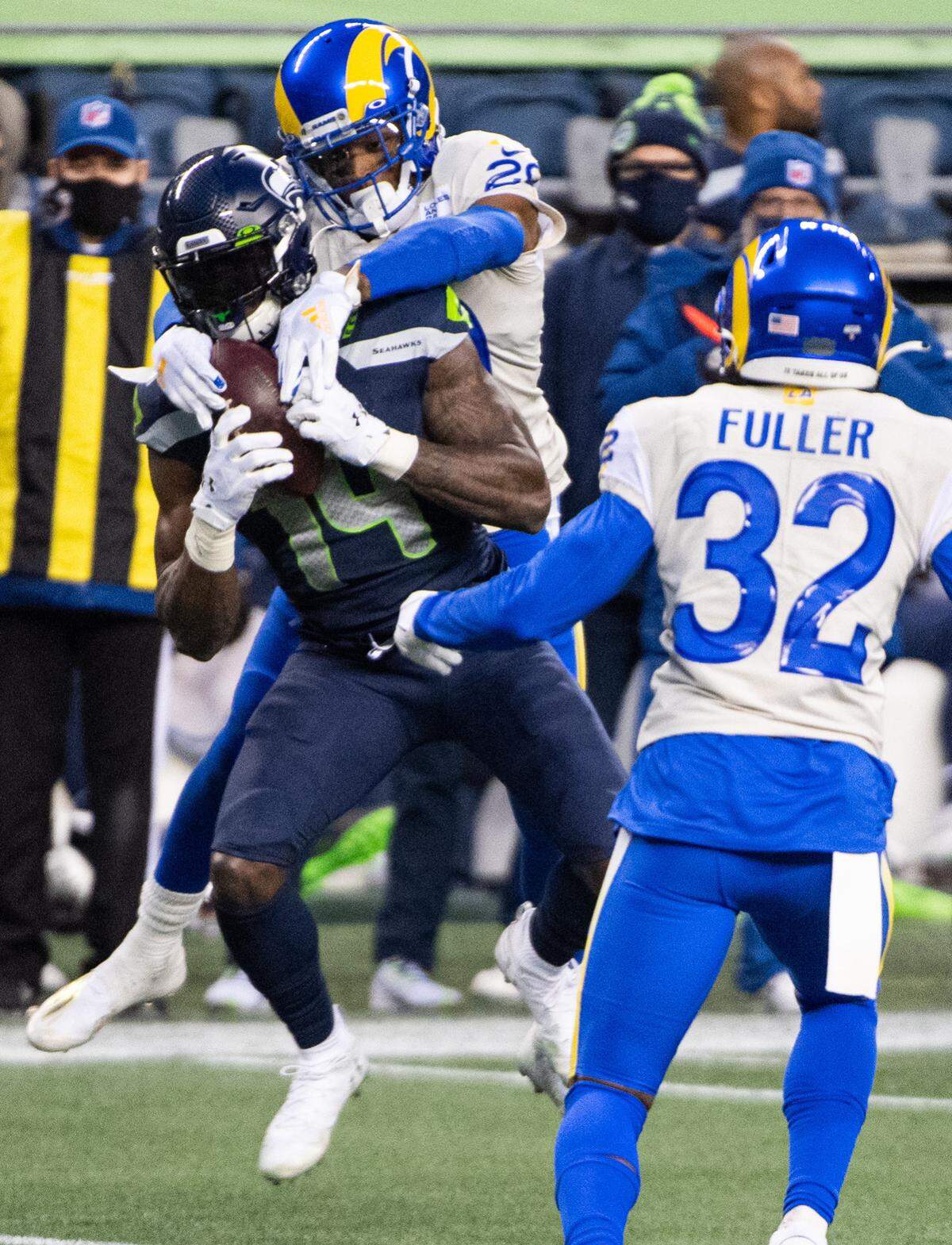 Seattle Seahawks wide receiver DK Metcalf makes a catch while defended by Los Angeles Rams cornerback Jalen Ramsey during the third quarter. The Seattle Seahawks played the Los Angeles Rams in a NFL wildcard playoff game at Lumen Field in Seattle, Wash., on Saturday, Jan. 9, 2021.