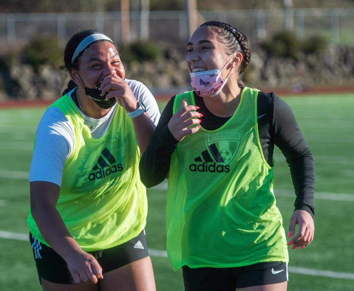 Auburn Riverside forward Samiah Shell shares a laugh with a teammate during a recent practice in Auburn on Wednesday, March 10, 2021.
