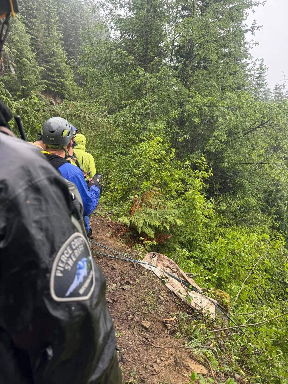 Crews rescue two men after a 250-foot cliff fall at T-Rex Falls near Wilkeson, Wash. on June 26, 2026.