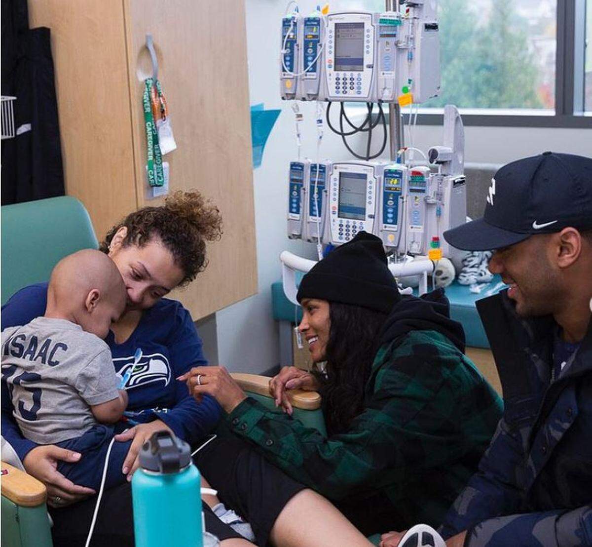 Russell Wilson and his wife Ciara visit with 17-month-old cancer patient Isaac Williams and his mother Kelli at Seattle Children’s hospital in November 2017. It was about 15 hours after Wilson and his Seahawks had lost a Monday night game to Atlanta. It was another of his nine years of weekly visits to the sickest of the sick at one of the premier treatment centers on the West Coast for kids with serious medical conditions.