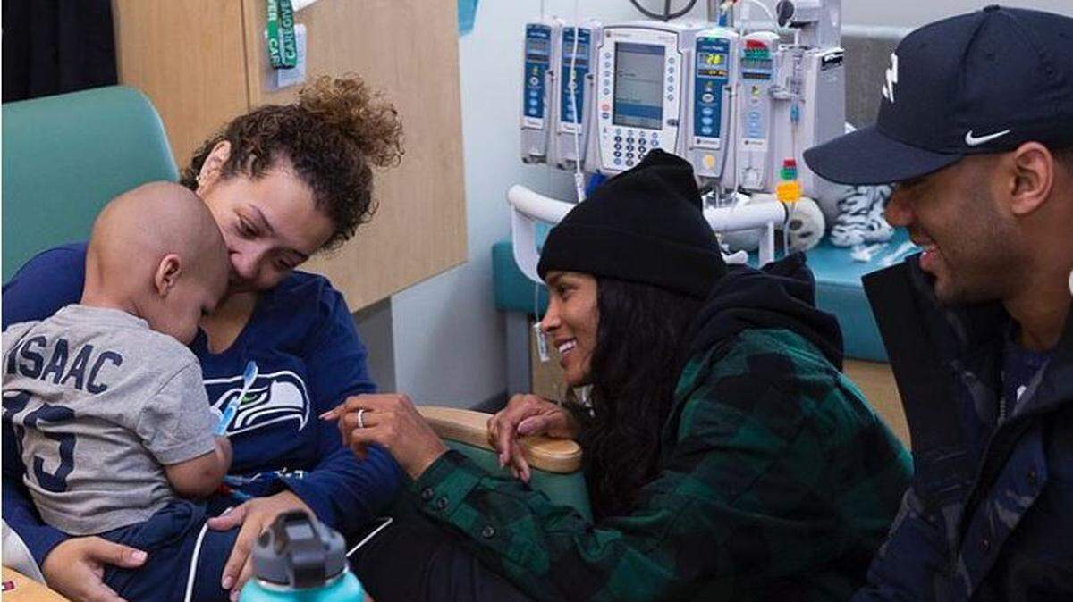 Russell Wilson and his wife Ciara visit with 17-month-old cancer patient Isaac Williams and his mother Kelli at Seattle Children’s hospital in November 2017. It was about 15 hours after Wilson and his Seahawks had lost a Monday night game to Atlanta. It was another of his nine years of weekly visits to the sickest of the sick at one of the premier treatment centers on the West Coast for kids with serious medical conditions.