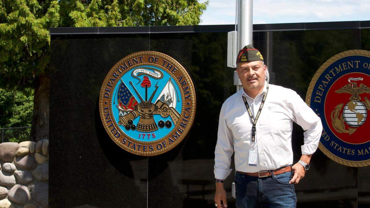 Paul Herrera poses in front of the Puyallup Tribal Veterans Memorial. Herrera on Tuesday was selected to fill a vacant seat on the Pierce County Council.