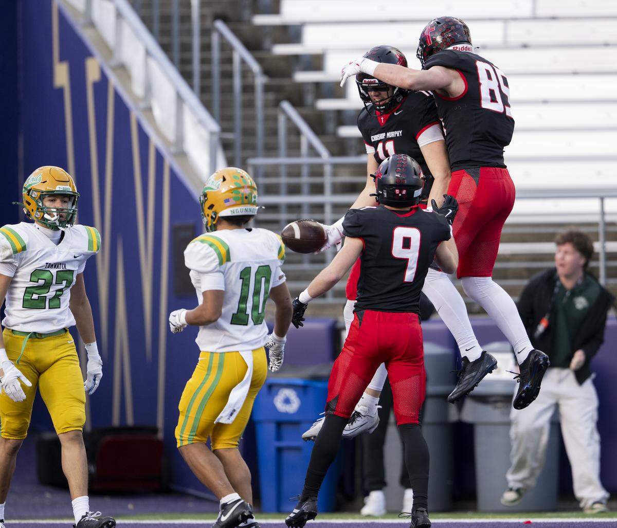Archbishop Murphy tight end Henry Gabalis (11) celebrates his touchdown with teammates during the first quarter of the 2A State Championship game at Husky Stadium, on Saturday, Dec. 6, 2025, in Seattle.
