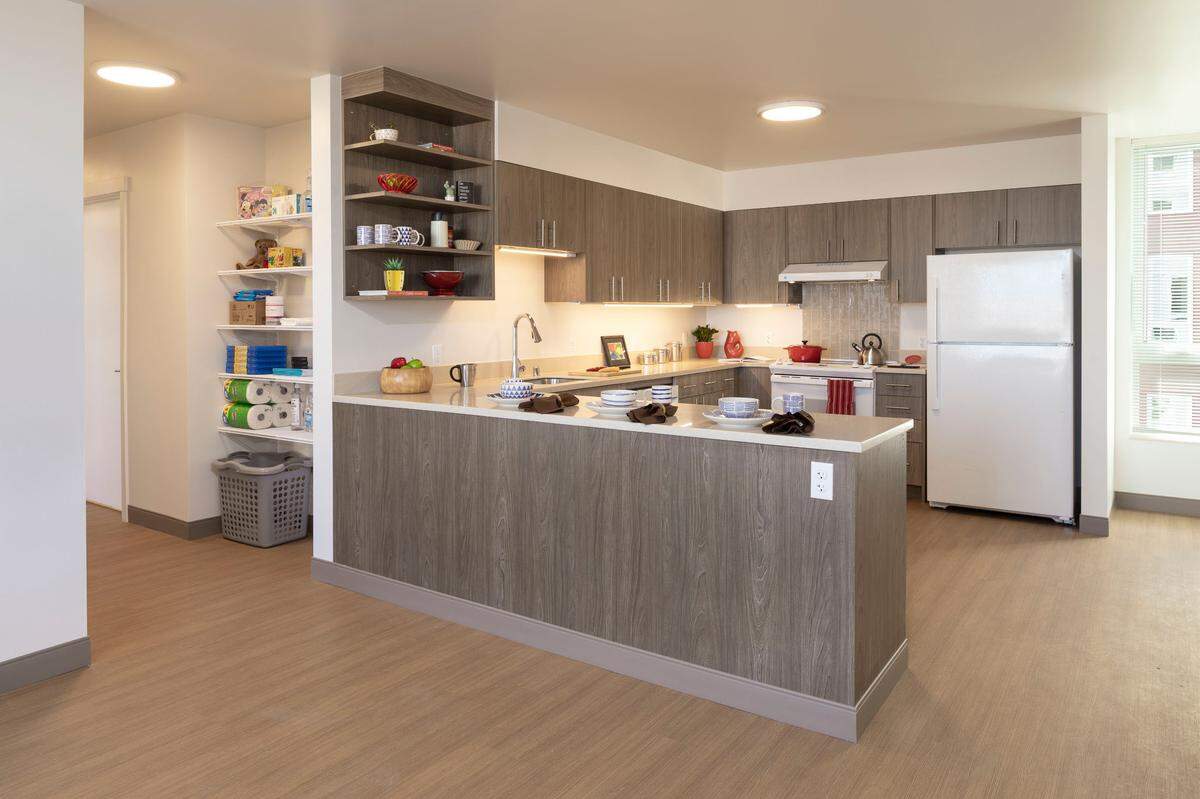 The tastefully appointed kitchen of an apartment in the newly finished $23 million YWCA Pierce County Dorothy Height Apartments affordable housing development on Broadway.