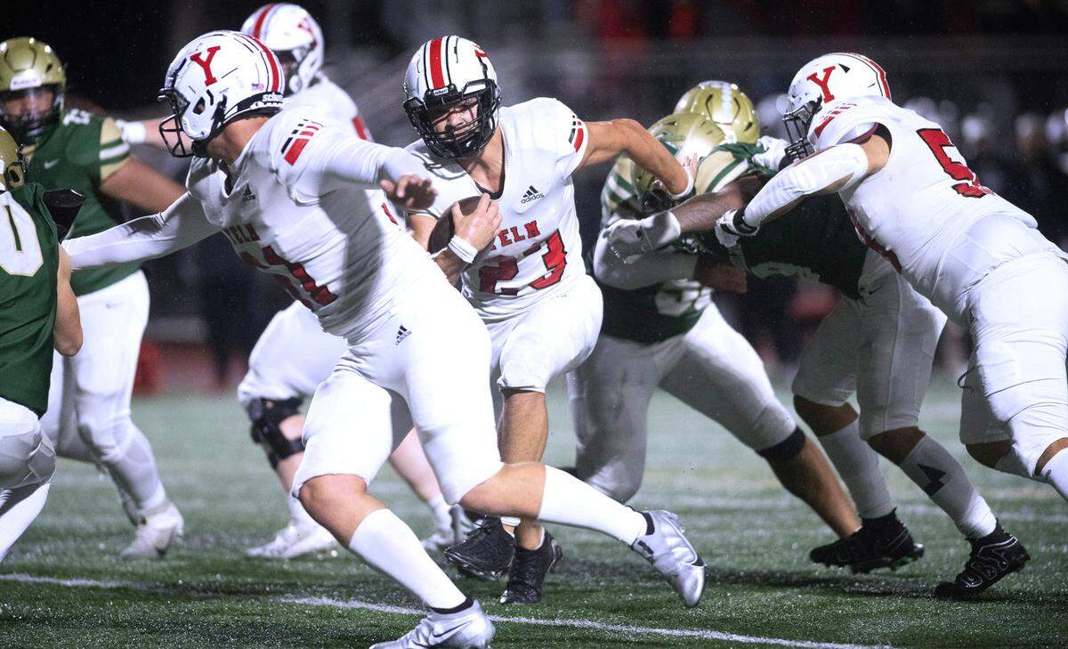 Yelm running back Brayden Platt follows blocker Chris Haas for a three-yard touchdown run during Friday night’s 3A SSC football game against the Timberline Blazers at South Sound Stadium in Lacey, Washington, on Oct. 13, 2023. Yelm won the game, 54-7.