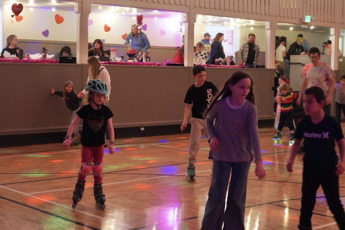 Skaters roll across the gym of the Key Peninsula Civic Center during Skate Night in Vaughn, Wash., Friday, Feb. 13, 2026.