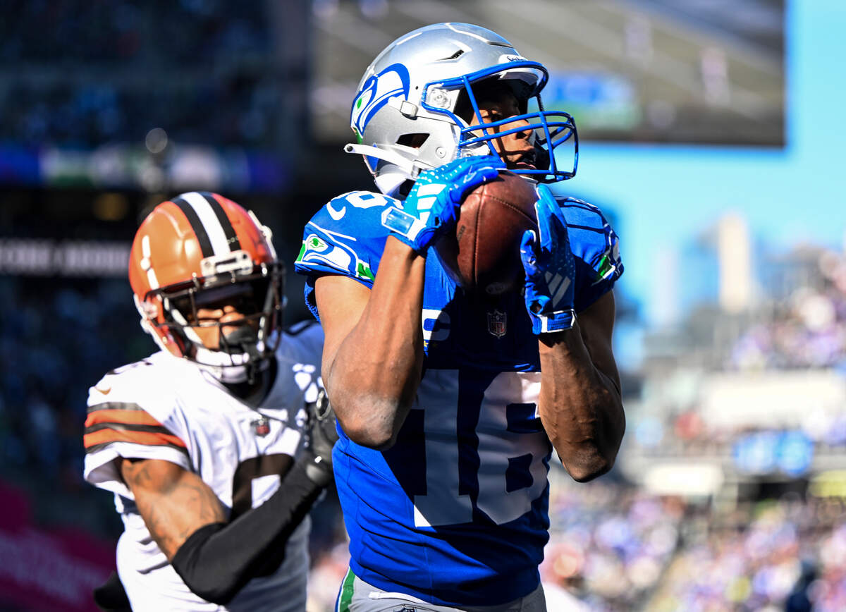 Seattle Seahawks wide receiver Tyler Lockett (16) catches a touchdown during the first quarter of the NFL game against the Cleveland Browns at Lumen Field, Sunday, Oct. 29, 2023, in Seattle.