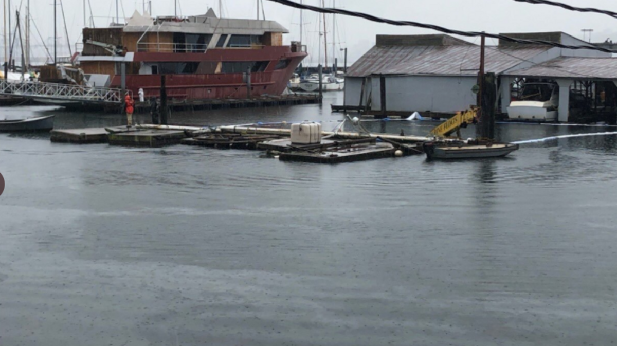 A barge carring a crane sank sometime early Monday at Tyee Marina on Marine View Drive in Tacoma.