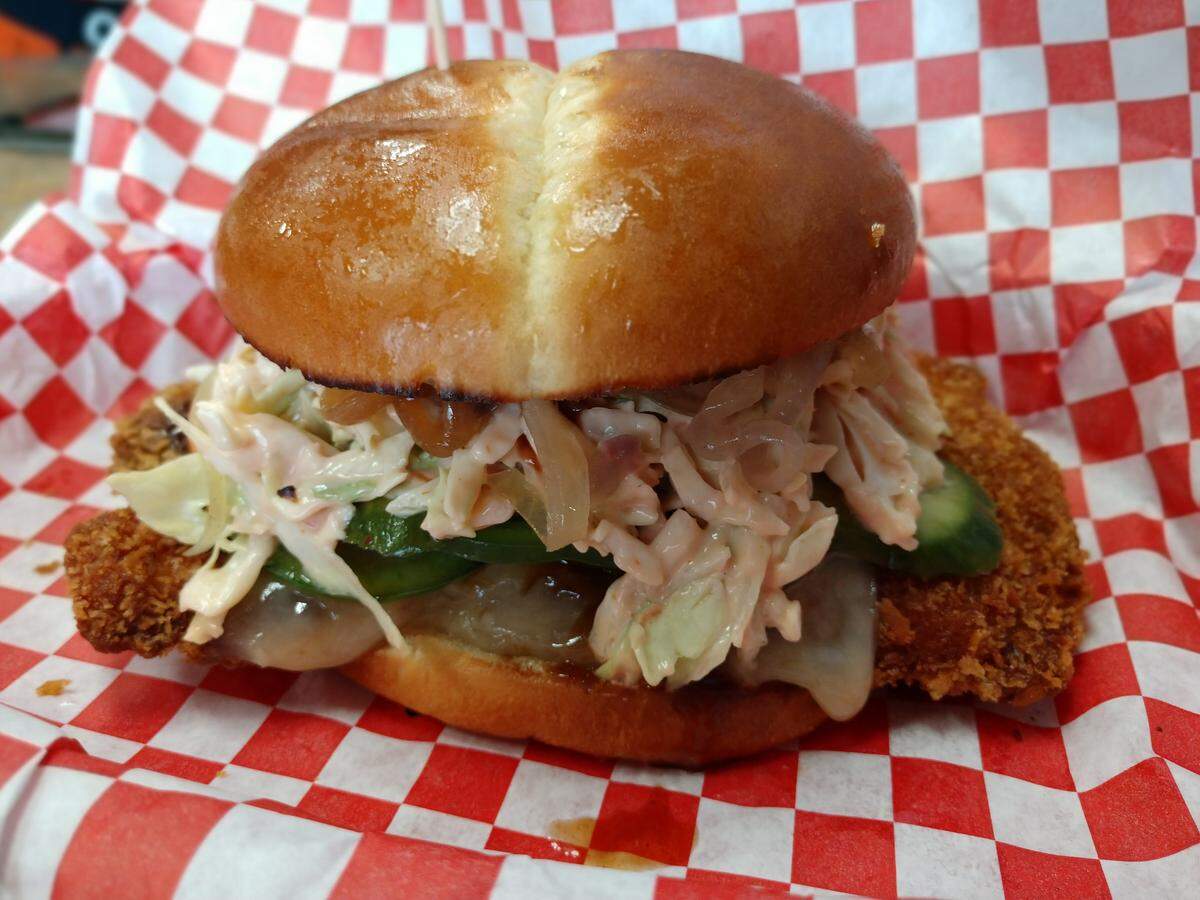 A chicken katsu burger with kimchi cucumber pickles at Build-A-Burger in Tacoma.