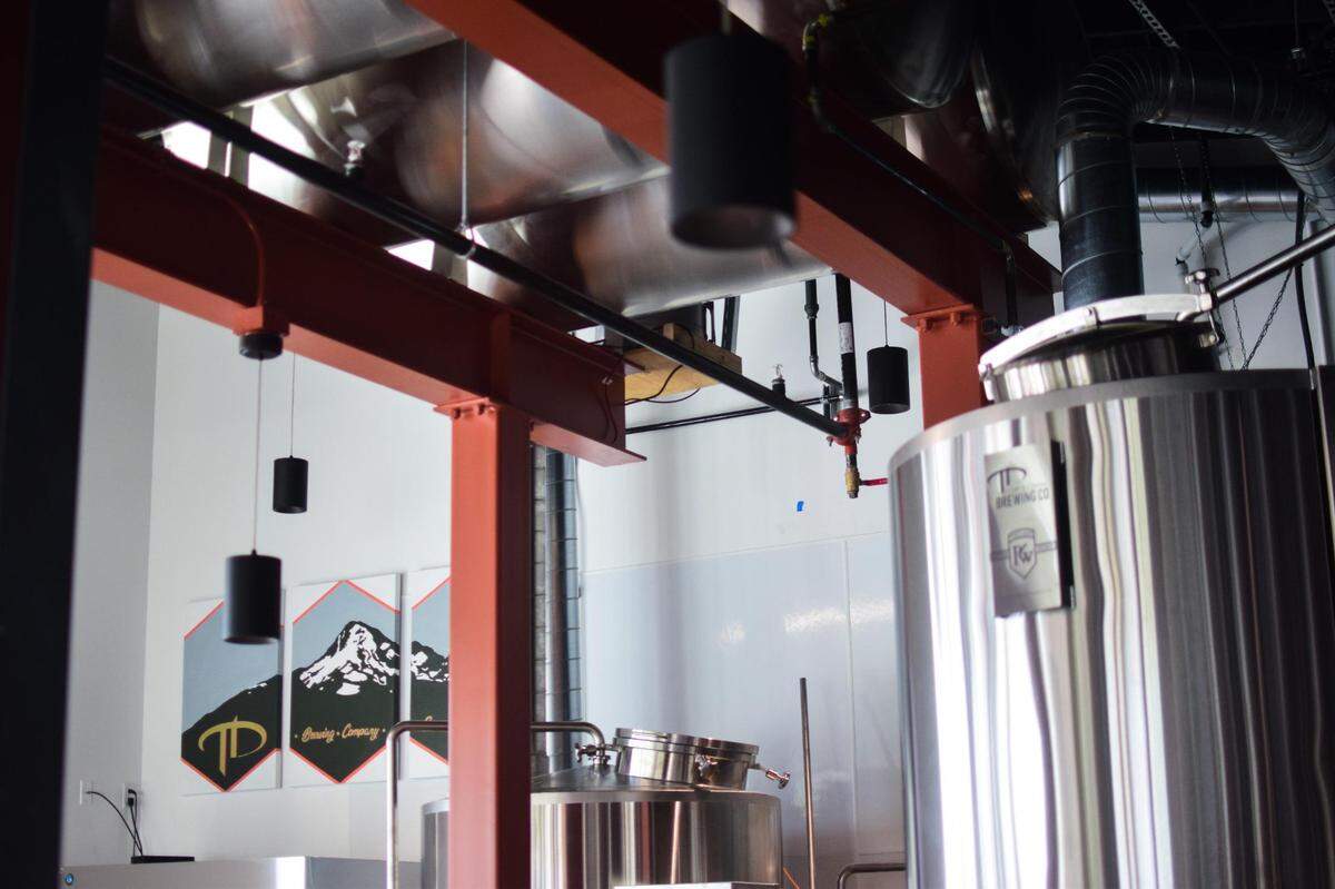Top Down Brewing is a new taproom and production facility in Sumner, Wash, located in the corner commercial space of The Main Apartments and Lofts.