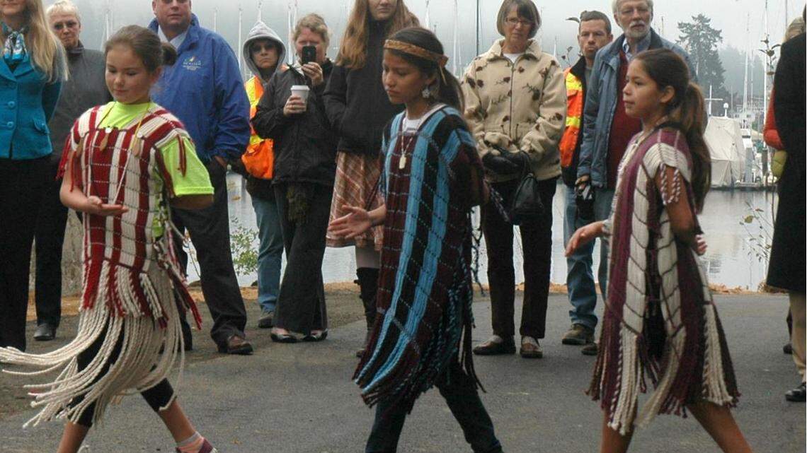 A dance troupe from the Puyallup Tribe of Indians performs during the Donkey Creek ribbon cutting in April 2018. The city council voted unanimously that year to approve $55,000 from the city’s art commission budget to support a project to place a new piece of Native American art in Austin Park to honor the local tribe.