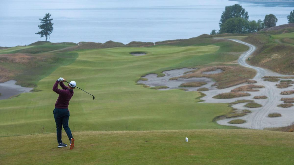 Luke Kluwer of Norfolk, Neb. tees off on hole number five in the first round of the U.S. Amateur Four-Ball Championship at Chambers Bay in University Place, Wash. on Saturday, May 22, 2021.