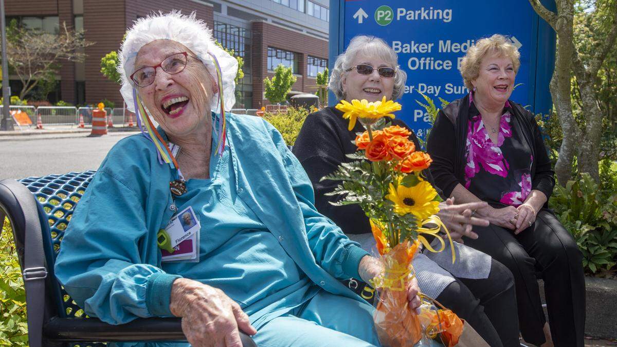 Florence “SeeSee” Rigney, believed to be the oldest registered nurse, beams with delight after fellow co-workers at Tacoma General Hospital sang “Happy Birthday” in honor of her turning 94 in May 2019. Seated alongside her are retired RNs Cheryl Davis, center, and Janice Dawson, right.