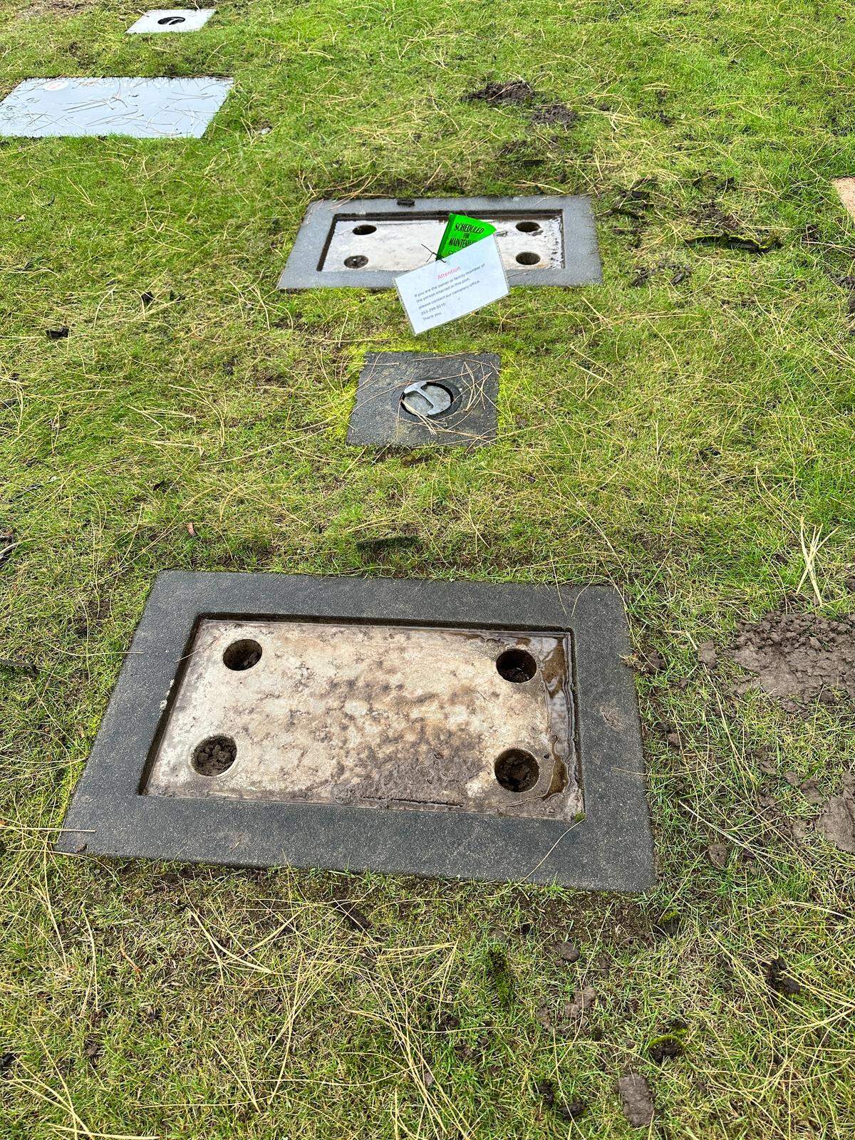A photo taken on Dec. 4, 2025 of two veteran plaques that have been damaged at Sumner Cemetery at 12324 Valley Ave East. Normally, these graves would have plates with a person’s name and dates on them. The Sumner Police Department is investigating the incident, which impacted 15 plaques at the cemetery. They believe the incident happened on Saturday, Nov. 29.