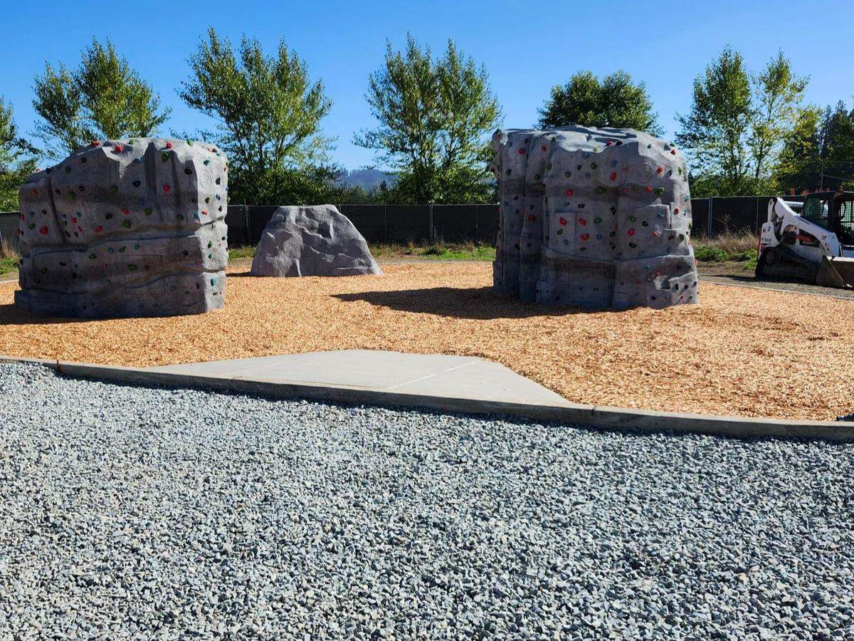 An image of the boulders at Van Lierop Playground, a new barn-themed play area at Van Lierop Park at 3401 Eighth Ave. SE. The city said the boulders were important for their vision of the playground, because it allows children to climb them and get a view of Mount Rainier. The playground is scheduled to open to the public on Oct. 30, 2025.