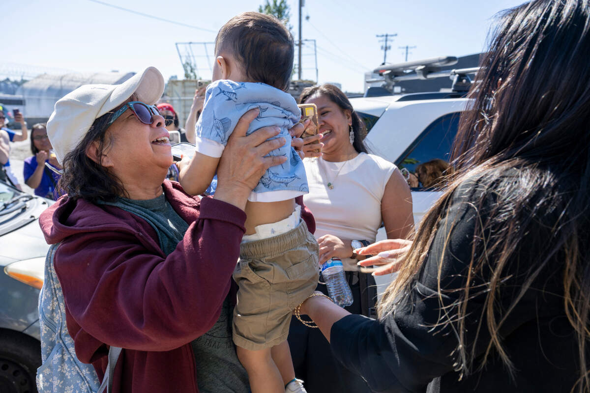 Lewelyn Dixon greets her family after being released from the Northwest ICE Processing Center on Thursday, May 29, 2025, where Dixon has been detained for months in Tacoma, Wash.