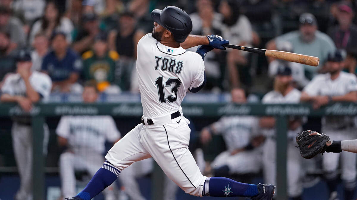 Seattle Mariners’ Abraham Toro hits a two-run home run against the Houston Astros during the ninth inning of a baseball game Tuesday, July 27, 2021, in Seattle. Toro was traded to the Mariners from the Astros earlier in the day. The Astros won 8-6. (AP Photo/Ted S. Warren)