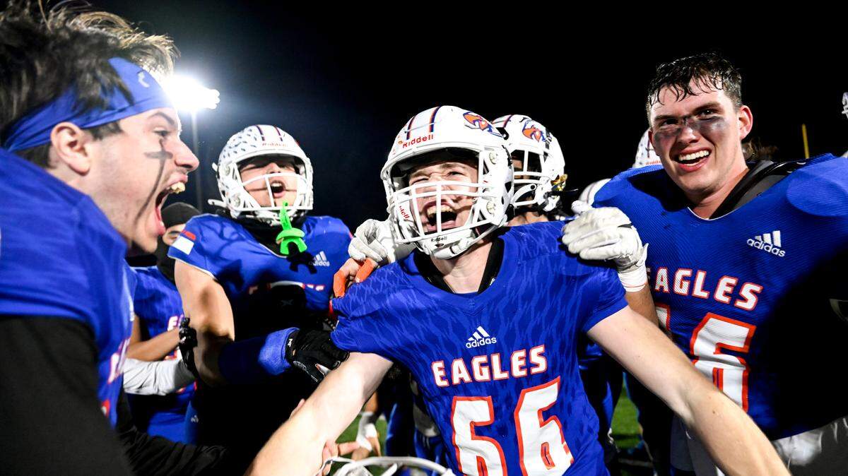 Graham-Kapowsin players celebrate the 20-14 win after Graham-Kapowsin’s Jonathan Haas (66) after he got a stop on one of Gonzaga Prep final offensive drives in the 4A quarterfinal state championship game at Art Crate Field, Saturday, Nov. 18, 2023, in Spanaway, Wash.