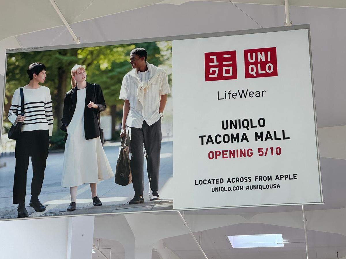 Banners inside the Tacoma Mall announce Uniqlo’s planned opening in May.