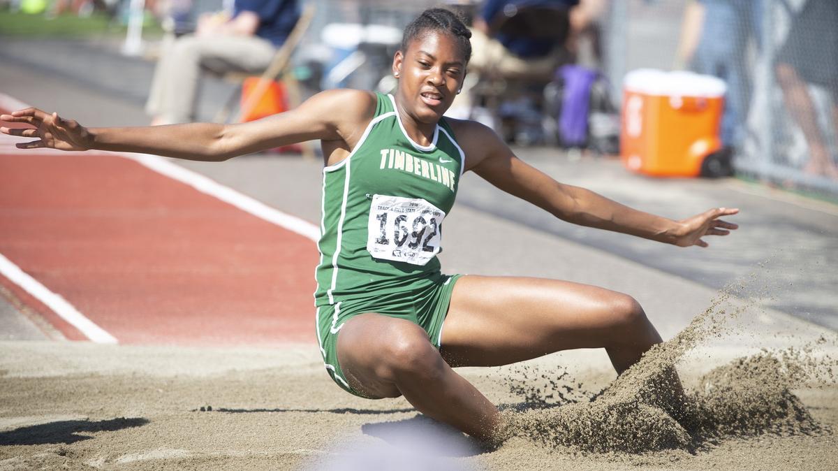 Timberline's Keshara Romain competes in the 3A girls triple jump finals on the opening day of the state track meet at Mt. Tahoma High School in Tacoma on Thursday, May 24, 2018.