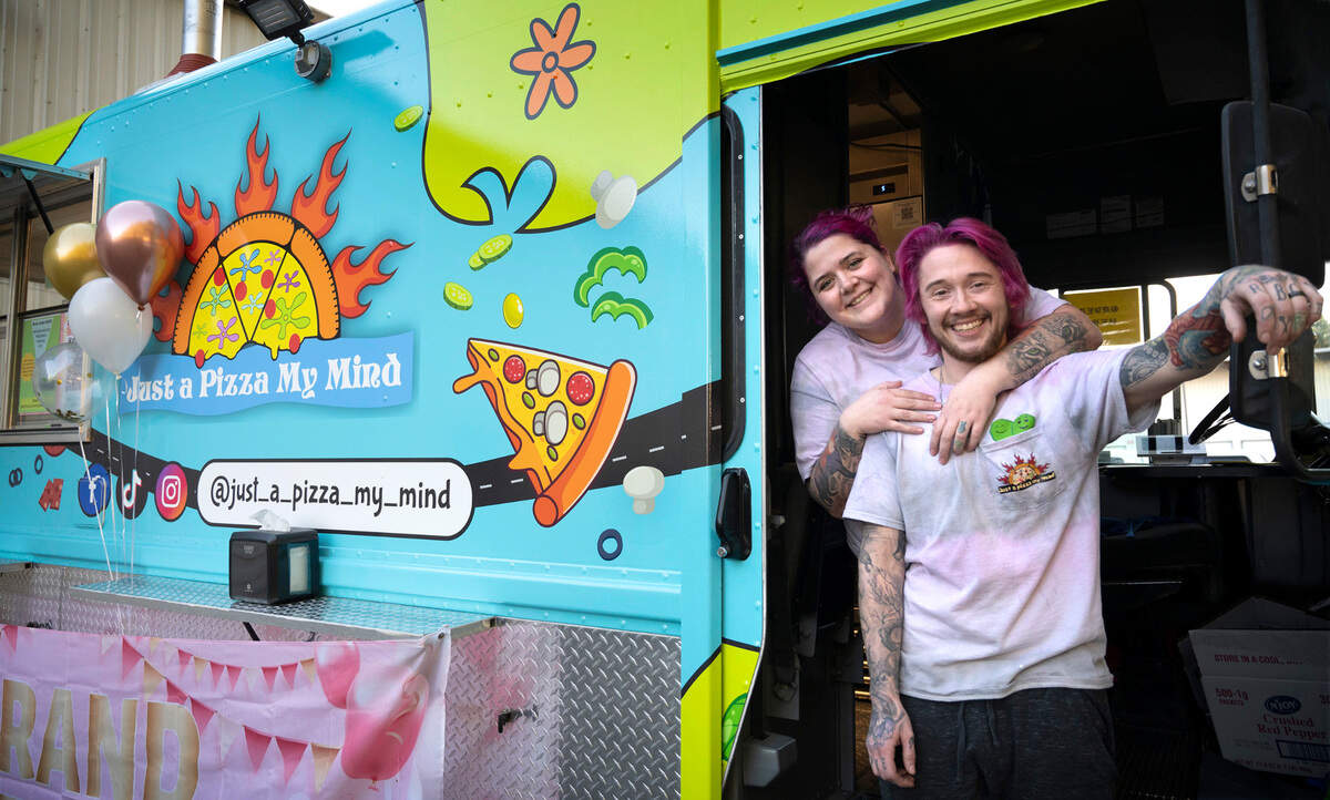 Melissa and Samuel Ranz at the grand opening of their “Just a Pizza My Mind” wood-fired pizza truck at Fierce County Cider in Puyallup, Washington, on Friday, Dec. 16, 2022.