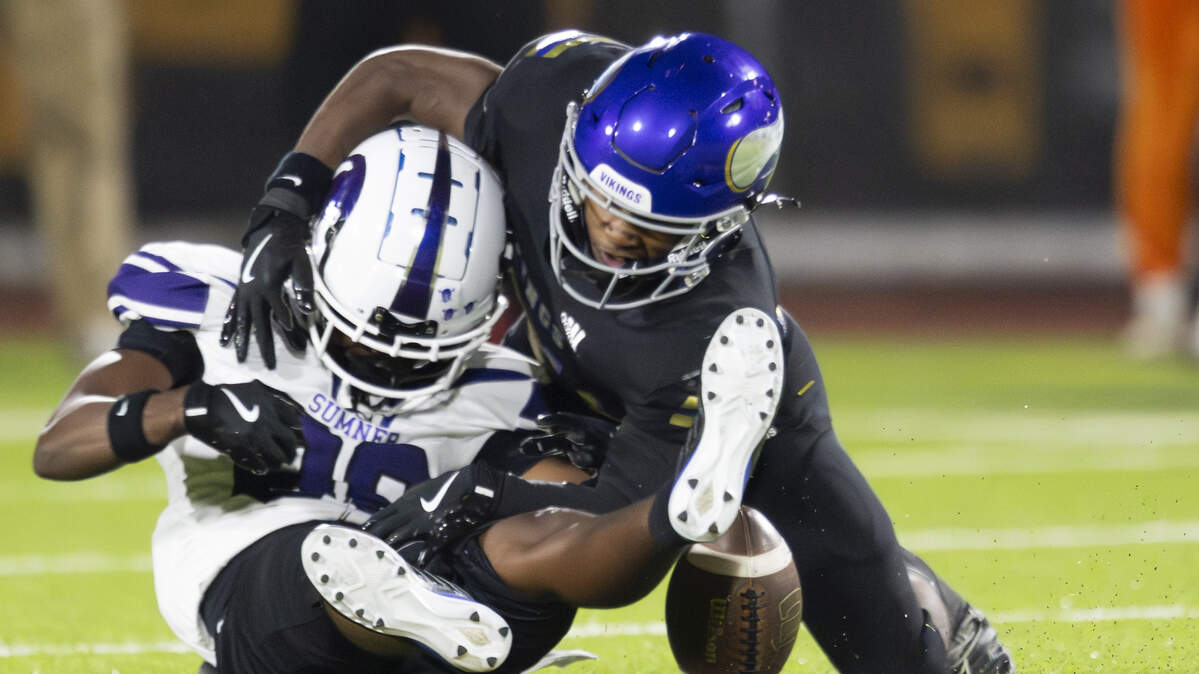 Sumner wide receiver Zakile Ncube (88) is tackled by Puyallup defensive back Briytan Bailey (21) during the second half of the game at Sparks Stadium, on Saturday, Oct. 4, 2025, in Puyallup, Wash.