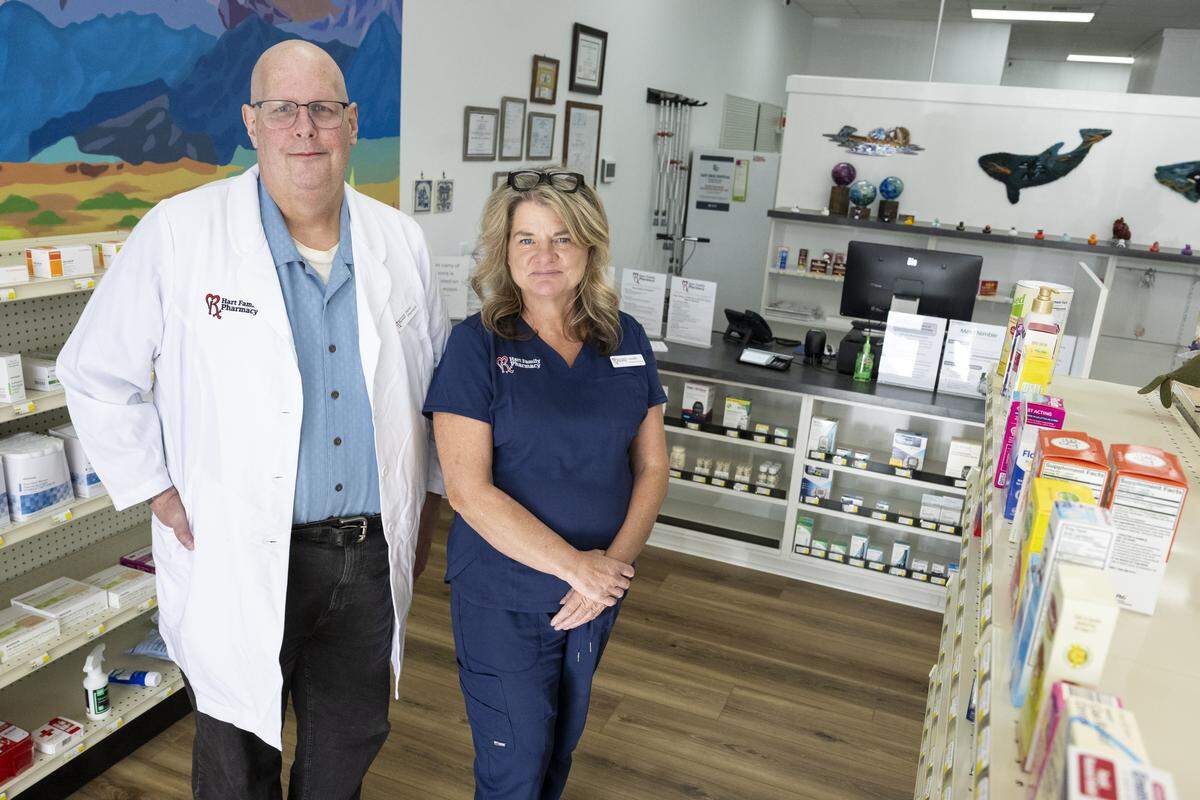 Darren Hart, left, owner and pharmacist of Hart Family Pharmacy, stands with Lanette Wilkins, a technician at the pharmacy, on Monday, Oct. 27, 2025, in Graham.