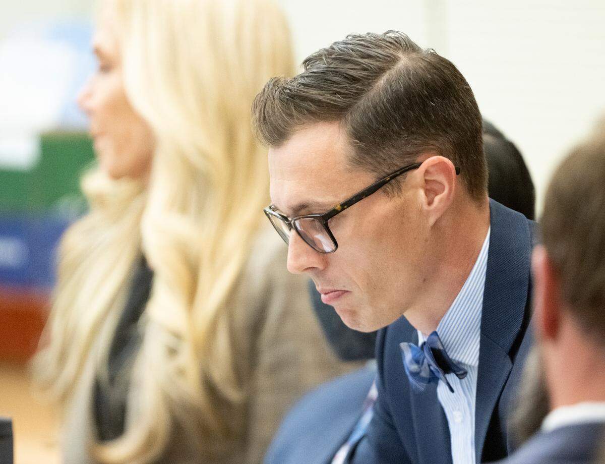 Defense attorney Mark Conrad looks a a powerpoint that will be used in the state’s closing arguments during the trial of three Tacoma Police officers in the killing of Manny Ellis at Pierce County Superior Court, Monday, Dec. 11, 2023, in Tacoma, Wash. Tacoma Police Officers Christopher Burbank, Matthew Collins and Timothy Rankine stand trial for charges related to the March 2020 killing of Manny Ellis. (Brian Hayes / Pool Photo – The News Tribune)
