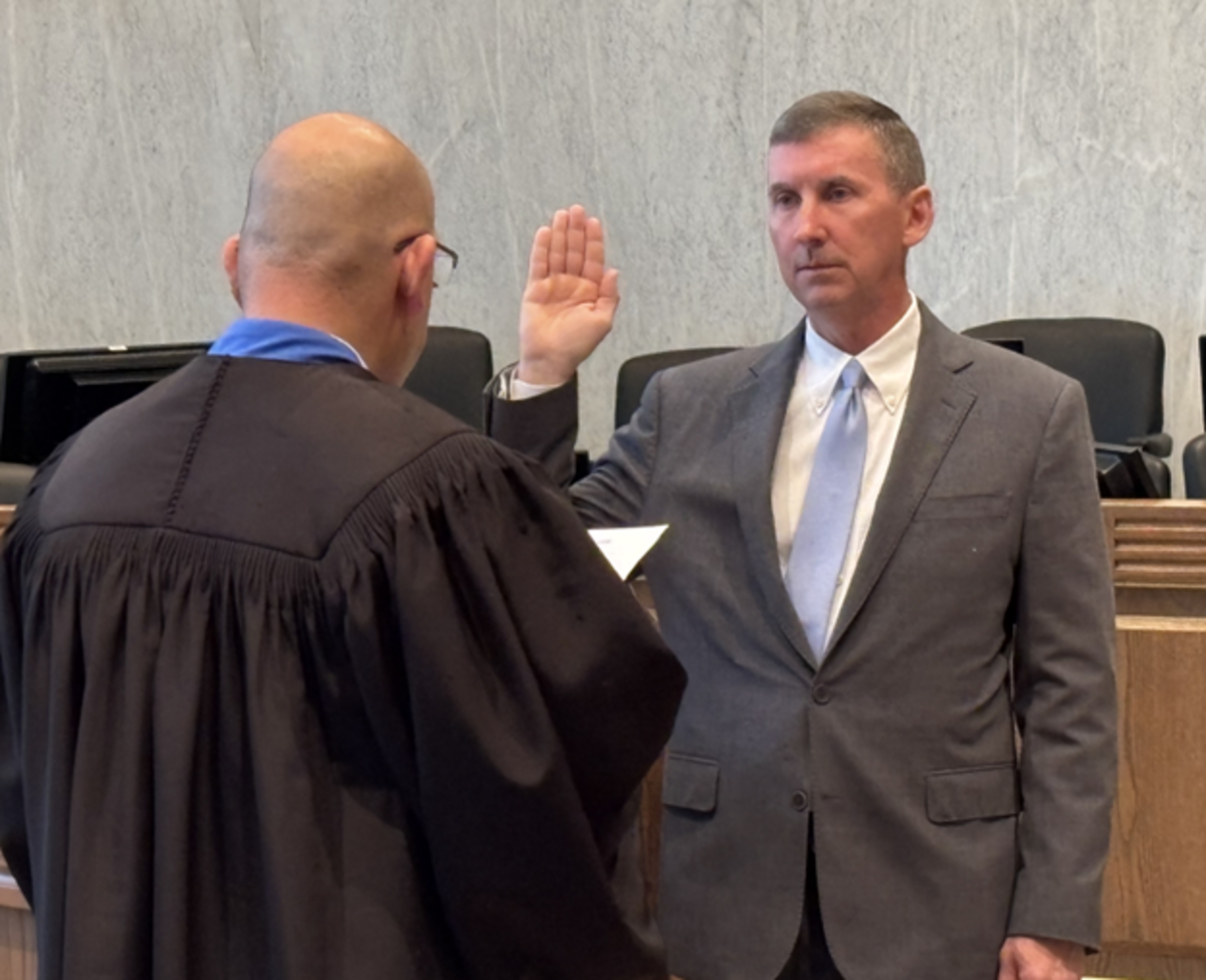 Interim U.S. Attorney for the Western District of Washington Charles Neil Floyd raises his right hand while Chief U.S. District Judge David G. Estudillo administers the oath of office on Monday, Oct. 6, 2025.