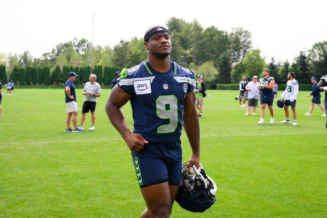 Jul 27, 2024; Renton, WA, USA; Seattle Seahawks running back Kenneth Walker III (9) jogs off the field after training camp at Virginia Mason Athletic Center. Mandatory Credit: Steven Bisig-USA TODAY Sports