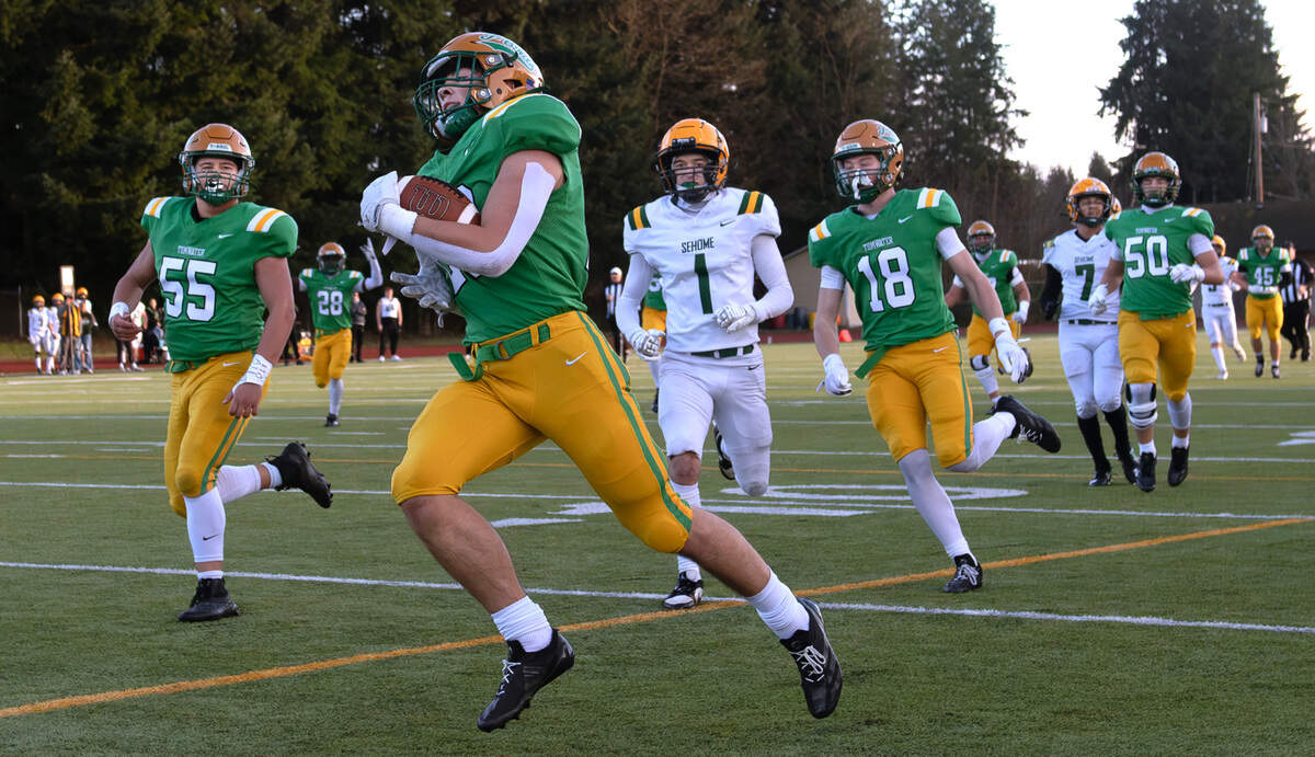 Tumwater running back Cash Short cruises into the end zone for a touchdown in front of the Sehome Mariners during Satuday afternoon’s state playoff game at Tumwater District Stadium in Tumwater, Washington, on Friday, Nov. 23, 2024. Tumwater won the game, 70-7, to advance to the state semifinals.
