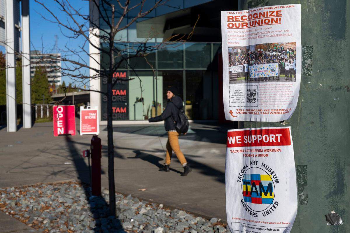 Flyers in support of the Tacoma Art Museum’s union are hung on a streetlight pole outside the museum on Dec. 16, 2022.