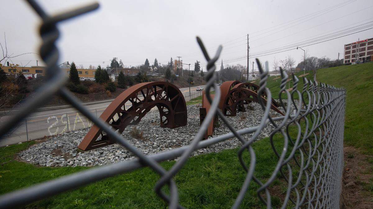 The “Gertie’s Ghost” sculpture park next to Sound Transit’s railroad line in downtown Tacoma, Washington, has been fenced in since its installation in 2019. The city says it’s to protect the young trees planted there, shown on Wednesday, Dec. 4, 2024, as well as protect the sculpture from vandalism.