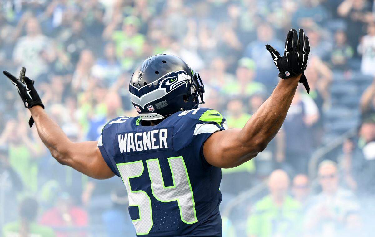 Seattle Seahawks linebacker Bobby Wagner (54) is welcomed by fans beforef the preseason game against the Dallas Cowboys at Lumen Field, Saturday, Aug. 19, 2023, in Seattle, Wash.
