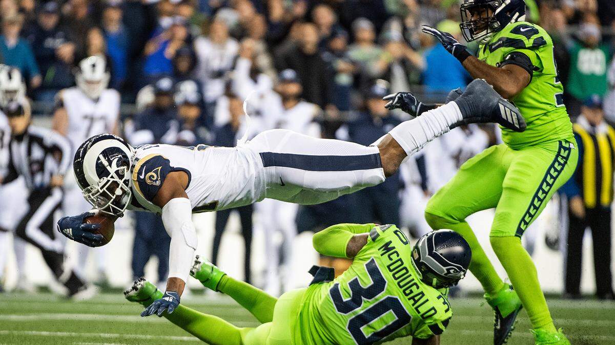 Los Angeles Rams tight end Gerald Everett (81) goes airborne trying to gain an extra yard during the fourth quarter. The Seattle Seahawks played the Los Angeles Rams in a NFL football game at CenturyLink Field in Seattle, Wash., on Thursday, Oct. 3, 2019.