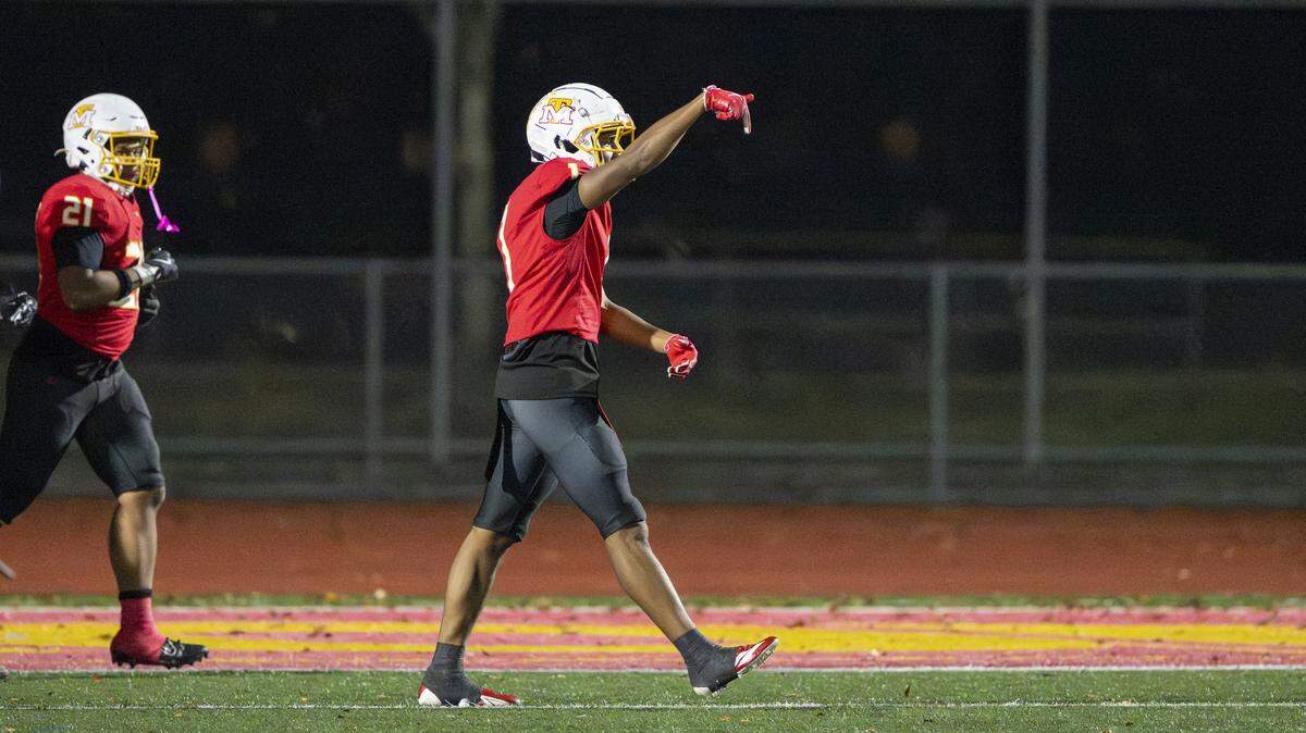 Mount Tahoma cornerback Elijah Durr (1), right, celebrates a touchdown against Lincoln on Saturday, Nov. 22, 2025, in Tacoma, Wash.