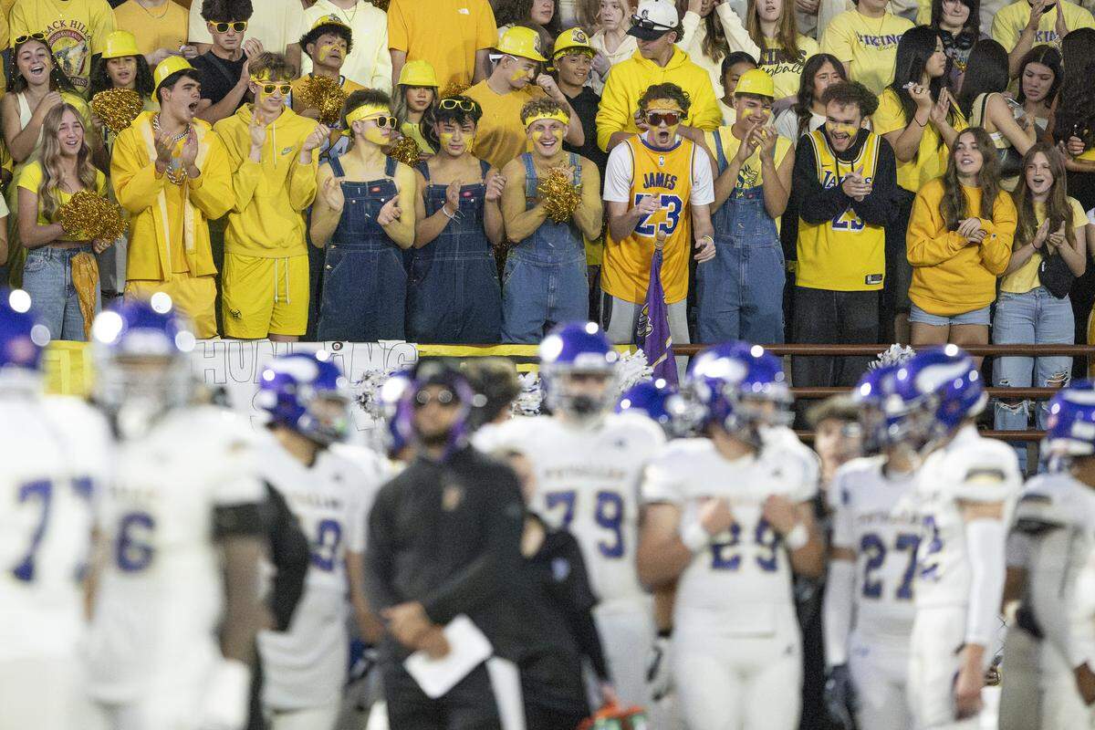 Puyallup fans cheer from the student section during a game against Emerald Ridge on Friday, Sept. 26, 2025, in Puyallup, Wash.