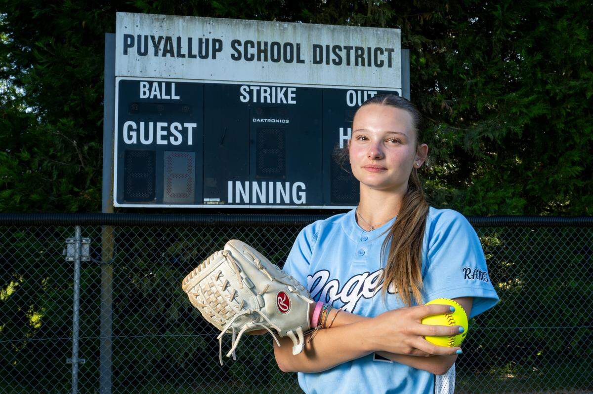 The News Tribune’s 2025 All-Area softball player of the year, Rogers High School freshman pitcher Sierra Murray, stands for a portrait on Tuesday, June 10, 2025, at the team’s home field in Puyallup, Wash.