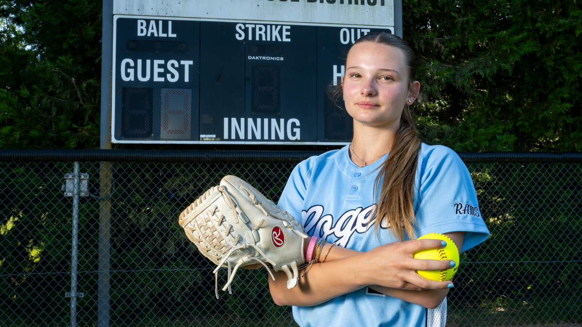 The News Tribune’s 2025 All-Area softball player of the year, Rogers High School freshman pitcher Sierra Murray, stands for a portrait on Tuesday, June 10, 2025, at the team’s home field in Puyallup, Wash.