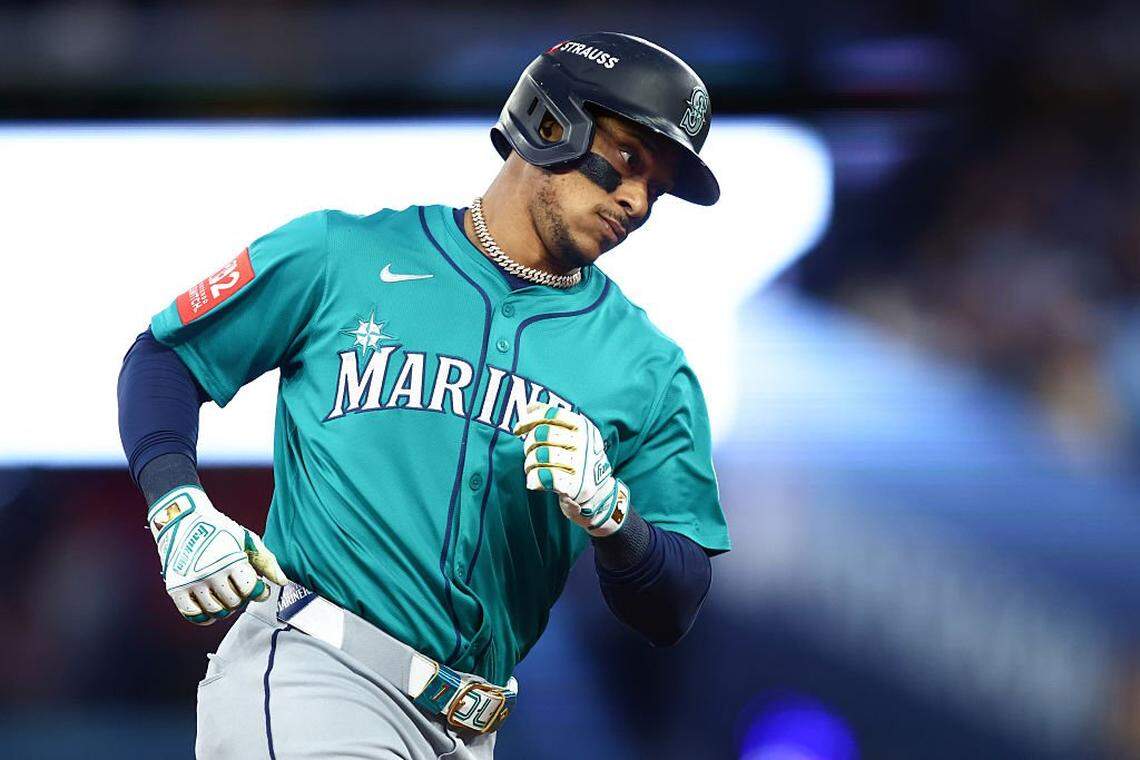 TORONTO, ONTARIO - OCTOBER 13: Jorge Polanco #7 of the Seattle Mariners rounds the bases after hitting a three run home run against the Toronto Blue Jays during the fifth inning in game two of the American League Championship Series at Rogers Centre on October 13, 2025 in Toronto, Ontario. (Photo by Cole Burston/Getty Images)