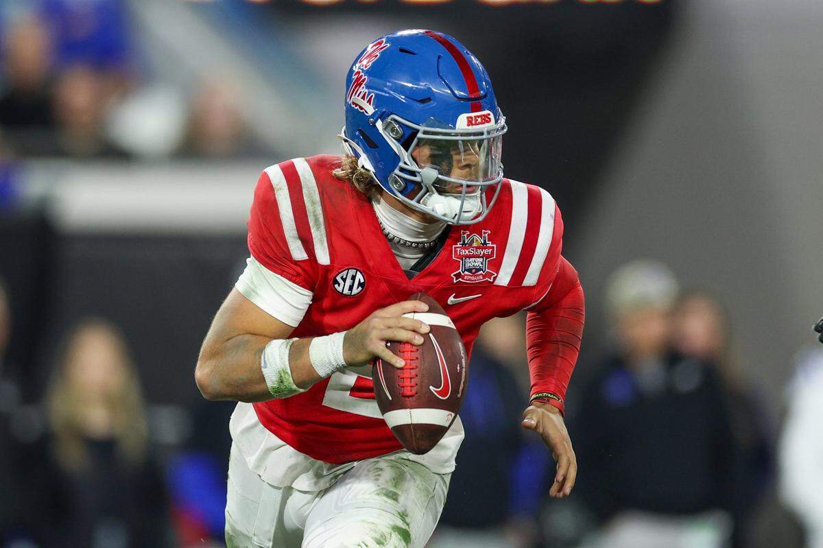 Jan 2, 2025; Jacksonville, FL, USA; Mississippi Rebels quarterback Jaxson Dart (2) drops back to pass against the Duke Blue Devils in the second quarter  during the Gator Bowl at EverBank Stadium. Mandatory Credit: Nathan Ray Seebeck-Imagn Images