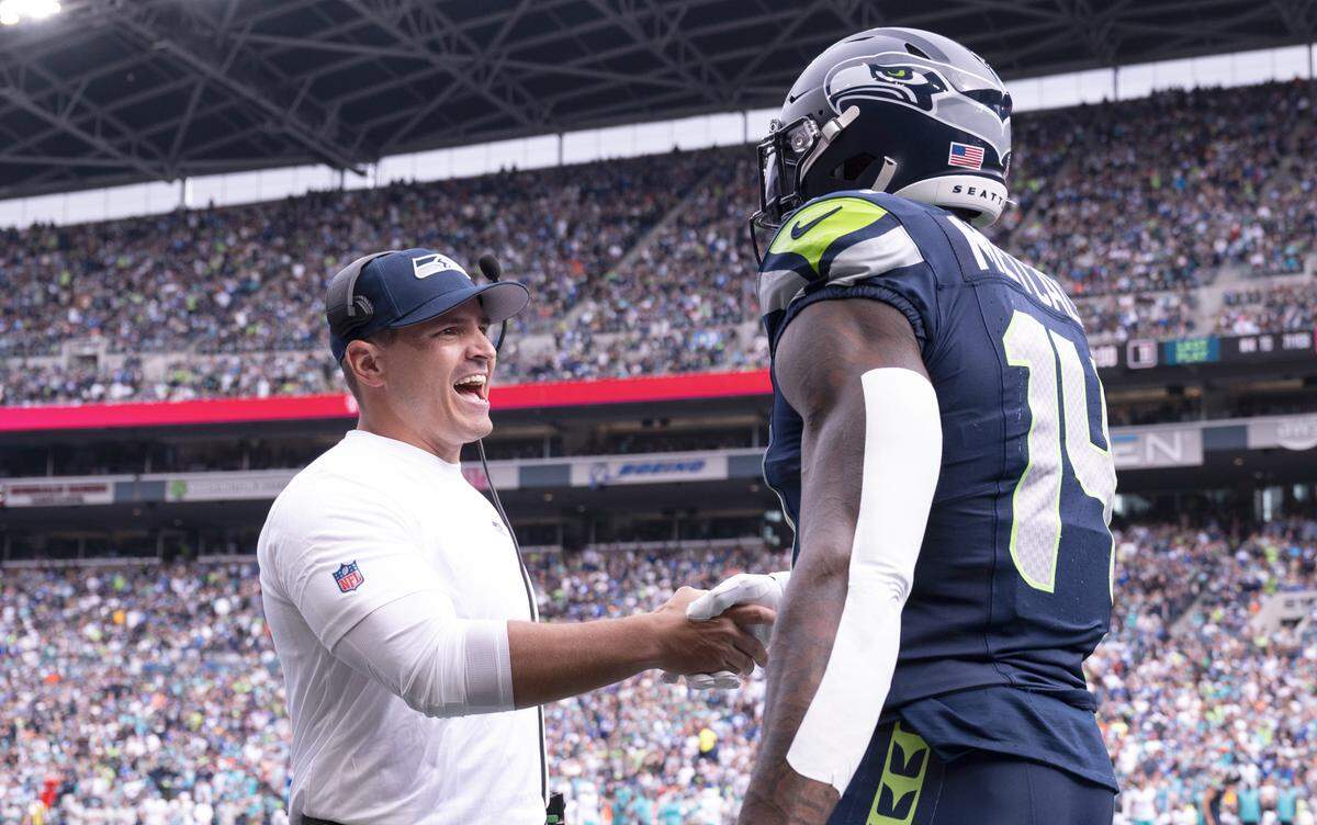 Seattle Seahawks head coach Mike Macdonald congratulates wide receiver DK Metcalf (14) after his touchdown during the first quarter of the game at Lumen Field, on Sunday, Sept. 22, 2024, in Seattle, Wash.