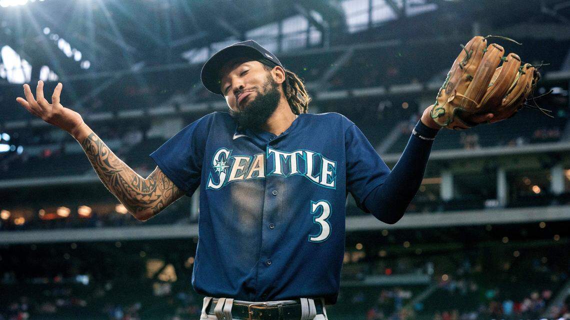 Seattle Mariners’ J.P. Crawford (3) gestures to fans in the middle of the eighth inning of a baseball game against the Texas Rangers, Thursday, Aug. 19, 2021, in Arlington, Texas. Seattle won 9-8. (AP Photo/Jeffrey McWhorter)