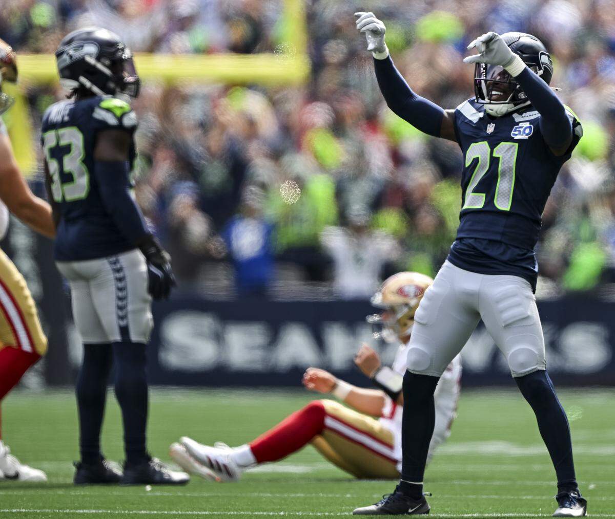 Seattle Seahawks cornerback Devon Witherspoon (21) reacts to a stop during the second quarter of the game against the San Francisco 49ers at Lumen Field, on Sunday, Sept. 7, 2025, in Seattle.