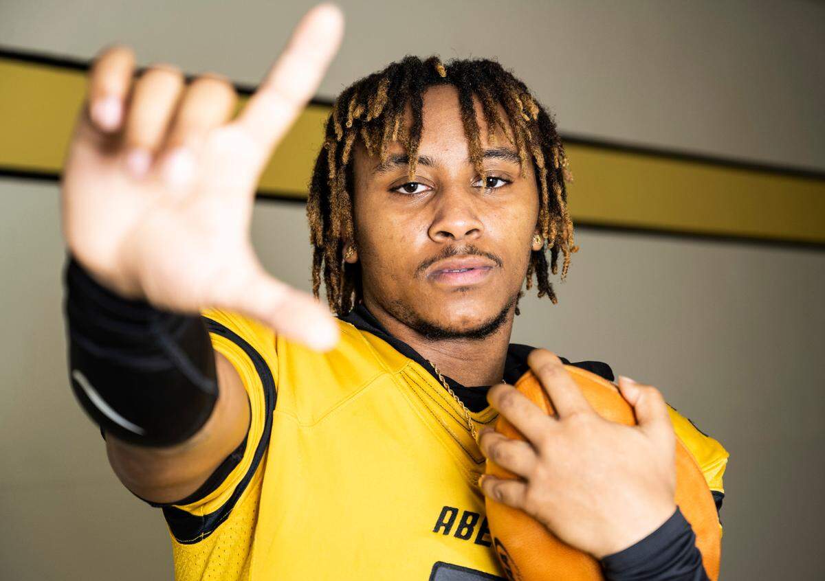 Lincoln senior and varsity football quarterback Gabarri Johnson poses for a portrait after being selected as the player of the year for The News Tribune’s 2022 All-Area football team, at Lincoln High School in Tacoma, Wash. on Dec. 8, 2022.