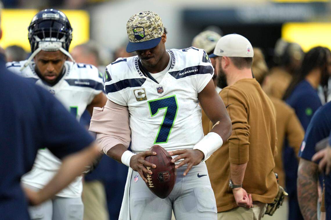 Seattle Seahawks quarterback Geno Smith (7) stands on the sideline after leaving the game due to injury during the second half of an NFL football game against the Los Angeles Rams Sunday, Nov. 19, 2023, in Inglewood, Calif. (AP Photo/Ashley Landis)