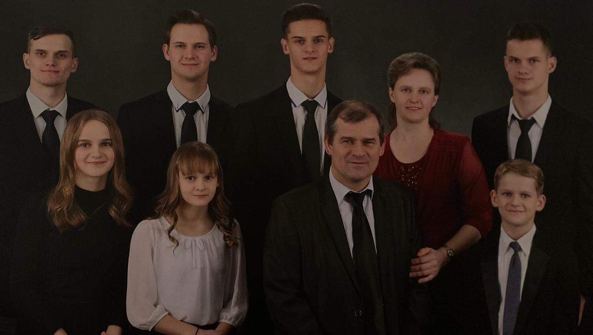 Bohdan Vetrov, fourth from right, is pictured with his wife and seven children. Vetrov, 57, died June 29, 2023 when two robbery suspects fled police in a stolen Kia Sportage and collided with his semi-truck in Lakewood. Vetrov’s family has filed a claim to sue the City of Lakewood, alleging the police pursuit violated state law and police department policy.