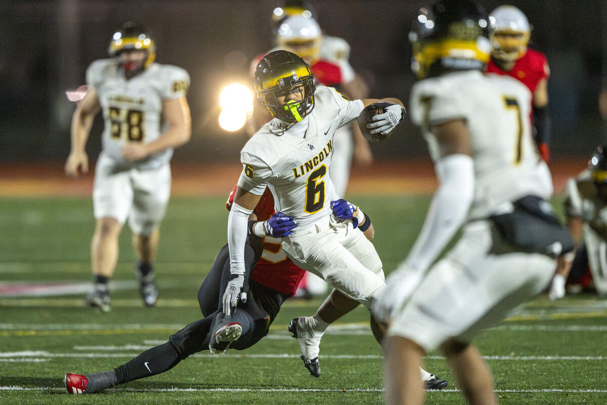Lincoln wide receiver Ilaikimi Malafu (6) attempts to pull away from Mount Tahoma outside linebacker Joshuah Durr (5) while carrying the ball on Saturday, Nov. 22, 2025, in Tacoma, Wash.
